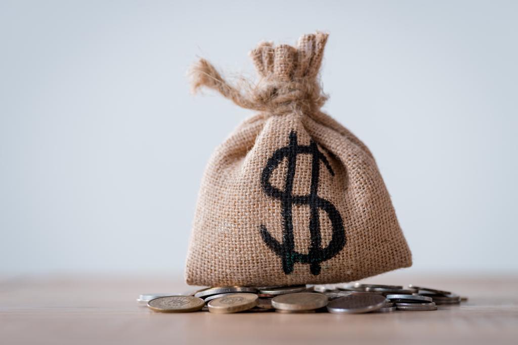 stock-photo-sackcloth-money-bag-dollar-sign-metal-coins-isolated-grey